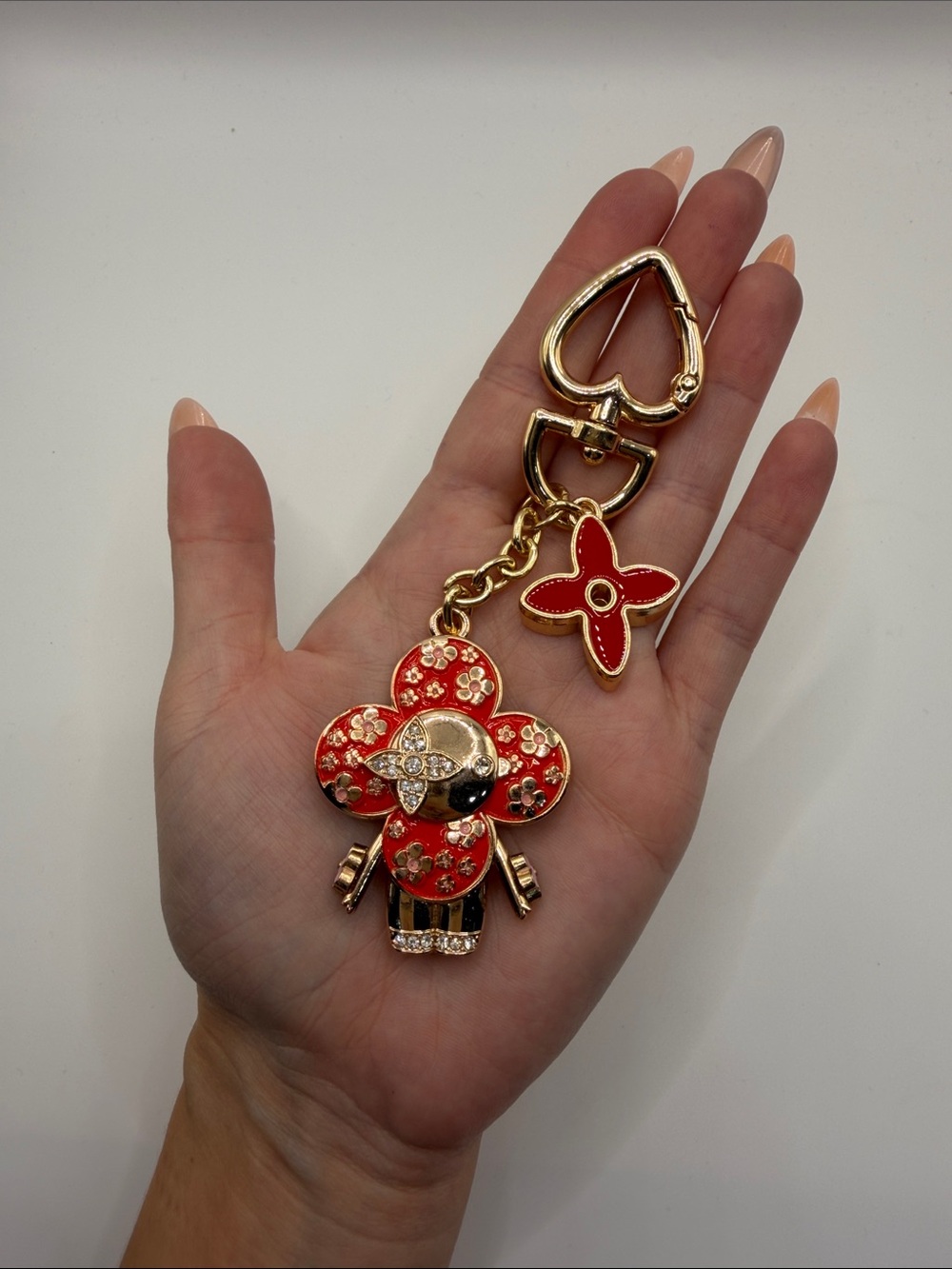 1410. Gold-Tone Red Vivi Charm Keychain or Bag Charm.